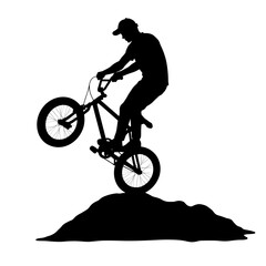 Obraz premium Biker performing a stunt on a dirt mound