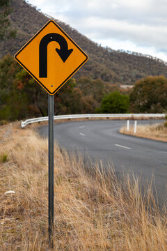 Sharp bend, turn in road sign on mountain road