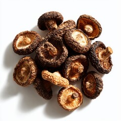 Pile of dried shiitake mushrooms on white background