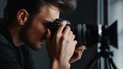 A photographer adjusting the camera lens for a portrait shoot. Featuring focus and creativity