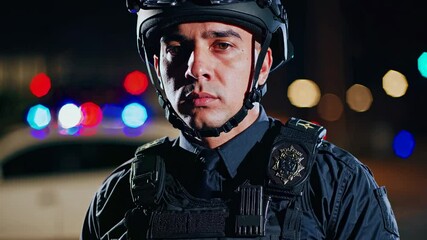 Confident police officer in full tactical gear illuminated by city lights. Perfect visualization of modern law enforcement and community protection services