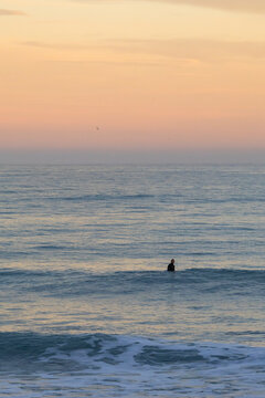 Sunset surf session off coast of Kaikoura, New Zealand