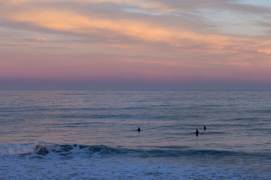 Sunset surf session off coast of Kaikoura, New Zealand