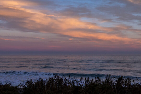 Sunset surf session off coast of Kaikoura, New Zealand