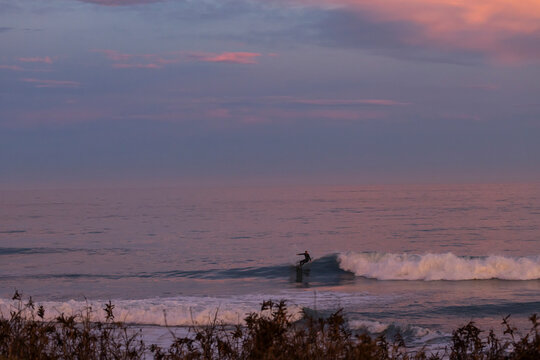 Sunset surf session off coast of Kaikoura, New Zealand