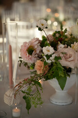 Romantic Floral Centerpiece with Candles at Coastal Wedding Rece