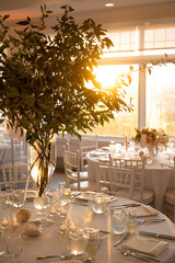 Elegant Coastal Wedding Table Setting with Tall Greenery at Suns