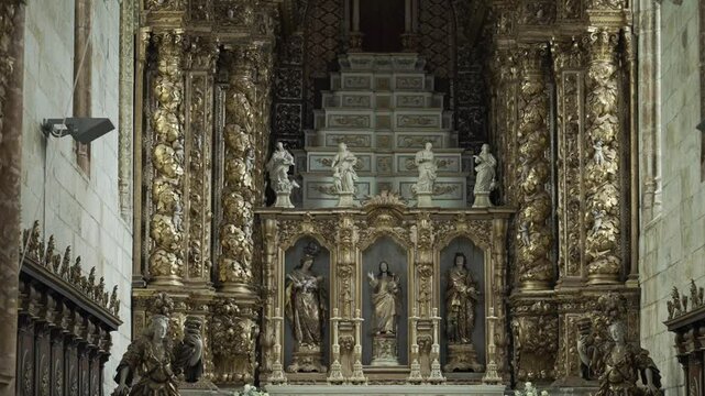 Elaborate gold Baroque altar with religious sculptures location irrelevant