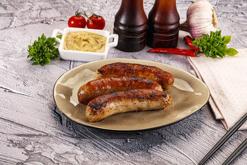 Delicous natural roasted sausages in the plate