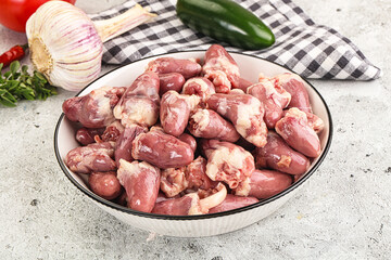 Fresh raw chicken hearts in the bowl