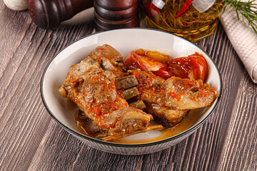 Baked lamb ribs with vegetables
