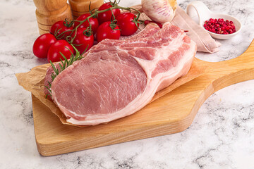 Raw potk loin steak with bone