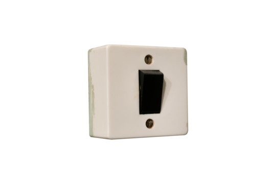 Old electrical light switch with a black toggle and white rectangular base is isolated.