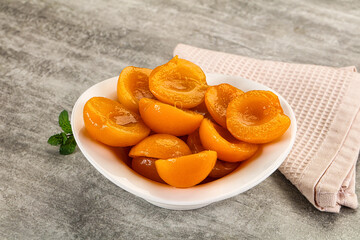 Sweet canned apricots with syrope