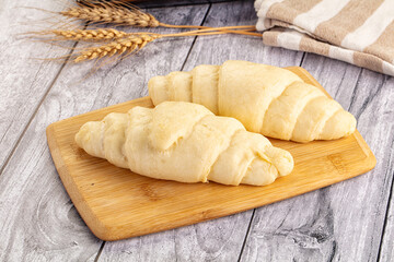 Raw uncooked croissant for bake