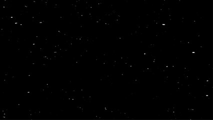 Fototapeta premium Snow on black background shot during a winter night with black backdrop. Snowfall on a black background