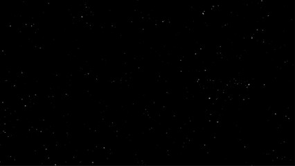 Real falling snow on a black background for use as a texture layer in a photo design. Snowfall on a black background