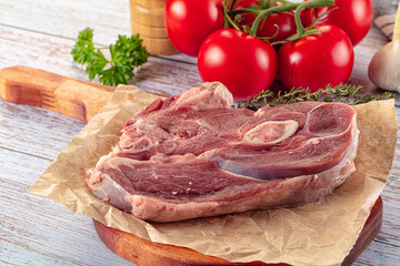 Raw lamb steak with bone
