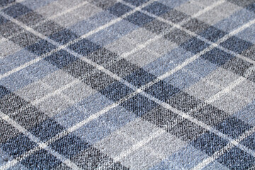 Blue and grey checkered fabric pattern creating textured background