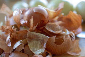 A peeled onion lying on the kitchen table. Onions are a vegetable rich in nutrients and trace elements.