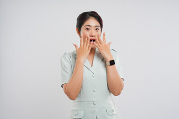 Overwhelmed woman with tearful expression hands covering mouth in surprise or shock reaction