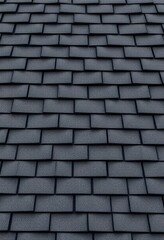 Seamless texture of black asphalt shingle roof, top view, texture