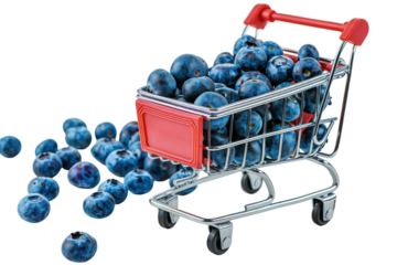 Vibrant blueberries overflowing from a miniature shopping cart create a whimsical display of nature’s bounty against a light background isolated on transparent background