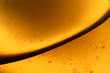 The surface of the cosmetic product has bubbles. blurred background. soft focus