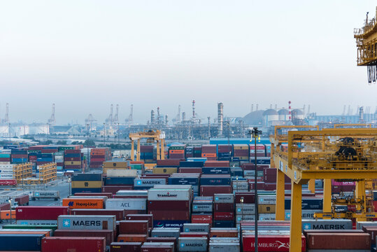 View of the container terminal, with stored containers and terminal equipment in sea port of Jebel Ali, UAE.