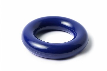 A glossy navy ring lying elegantly on a white surface, showcasing its smooth curves and refined design under soft lighting isolated on transparent background