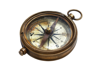 An antique brass compass resting on a white surface, showcasing intricate details and the passage of time in design and craftsmanship isolated on transparent background