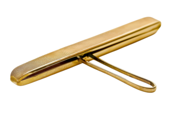 A golden squeegee resting elegantly on a bright surface, showcasing intricate details and a simple yet artistic design isolated on transparent background