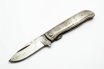 A weathered folding knife resting on a surface, showcasing its unique design and vintage character under bright lighting isolated on transparent background