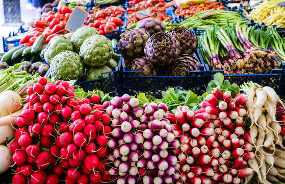 Vibrant display of fresh vegetables at a bustling market in spring showcasing local produce and agricultural abundance