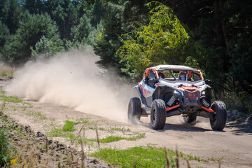 UTV buggy, 4x4 competition on dusty road. Rally, extreme, adrenalin