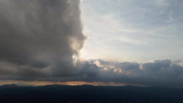 Powerful sky with clouds rolling in, storm brewing on the distant horizon.