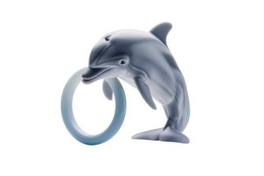 A playful dolphin figurine interacts with a translucent blue ring in a minimalistic studio setting, capturing whimsy and joy in artistry isolated on transparent background