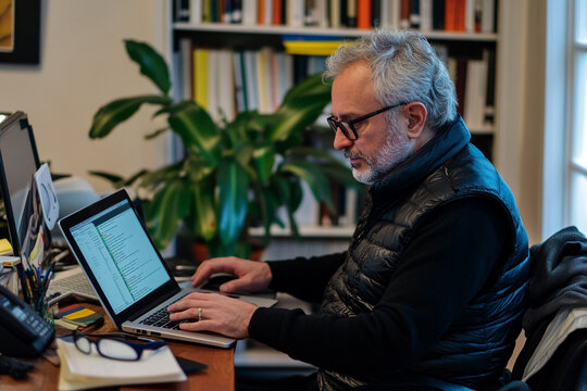 Man working from home on laptop in home office