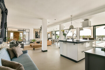 A beautifully designed modern interior featuring an open layout with elegant furniture, natural light, and stylish decor elements that create a welcoming atmosphere.