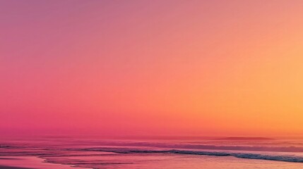 Obraz premium Sunset as a soft pink gradient fading into peach over an empty beach