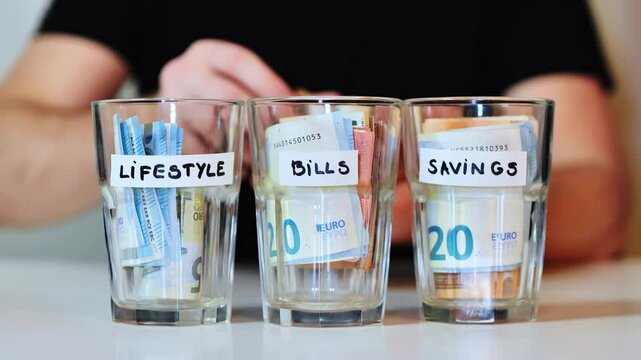 Counting money from labeled glass as part of personal savings, spending system