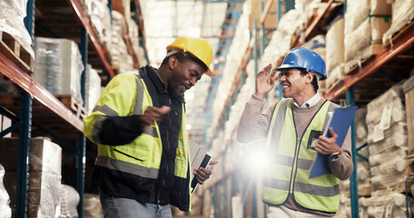 Men, celebration and dancing at warehouse for logistics with smile, support and goals with success. People, partner and team with rhythm, cheers and happy for distribution, shipping and supply chain