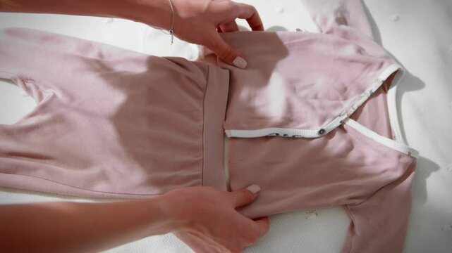 Children's clothes on the bed top view