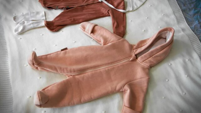 Children's clothes on the bed top view