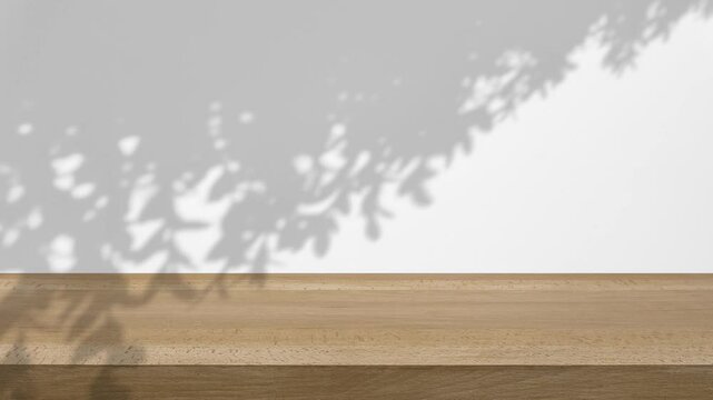 shadow of the trees gently swaying in the breeze, on a white background with a wooden table.