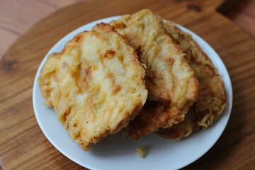 Pisang goreng or fried banana. Popular street food in Southeast Asia, especially in Indonesia, Malaysia, and Singapore. Selective focus.