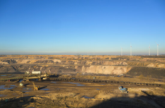 Lignite mining site near Garzweiler with wind turbines in the background