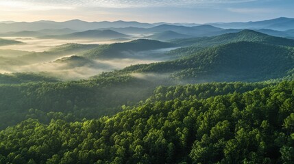 Fototapeta premium Aerial Panoramic View of Misty Mountains and Forest