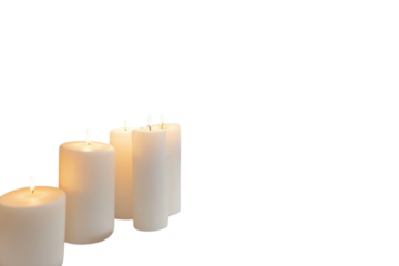 Warm candlelight illuminates a cozy holiday setting with a decorated tree, creating a serene atmosphere for winter gatherings isolated on transparent background