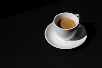 Shot Of Espresso on Black Table. Coffee.